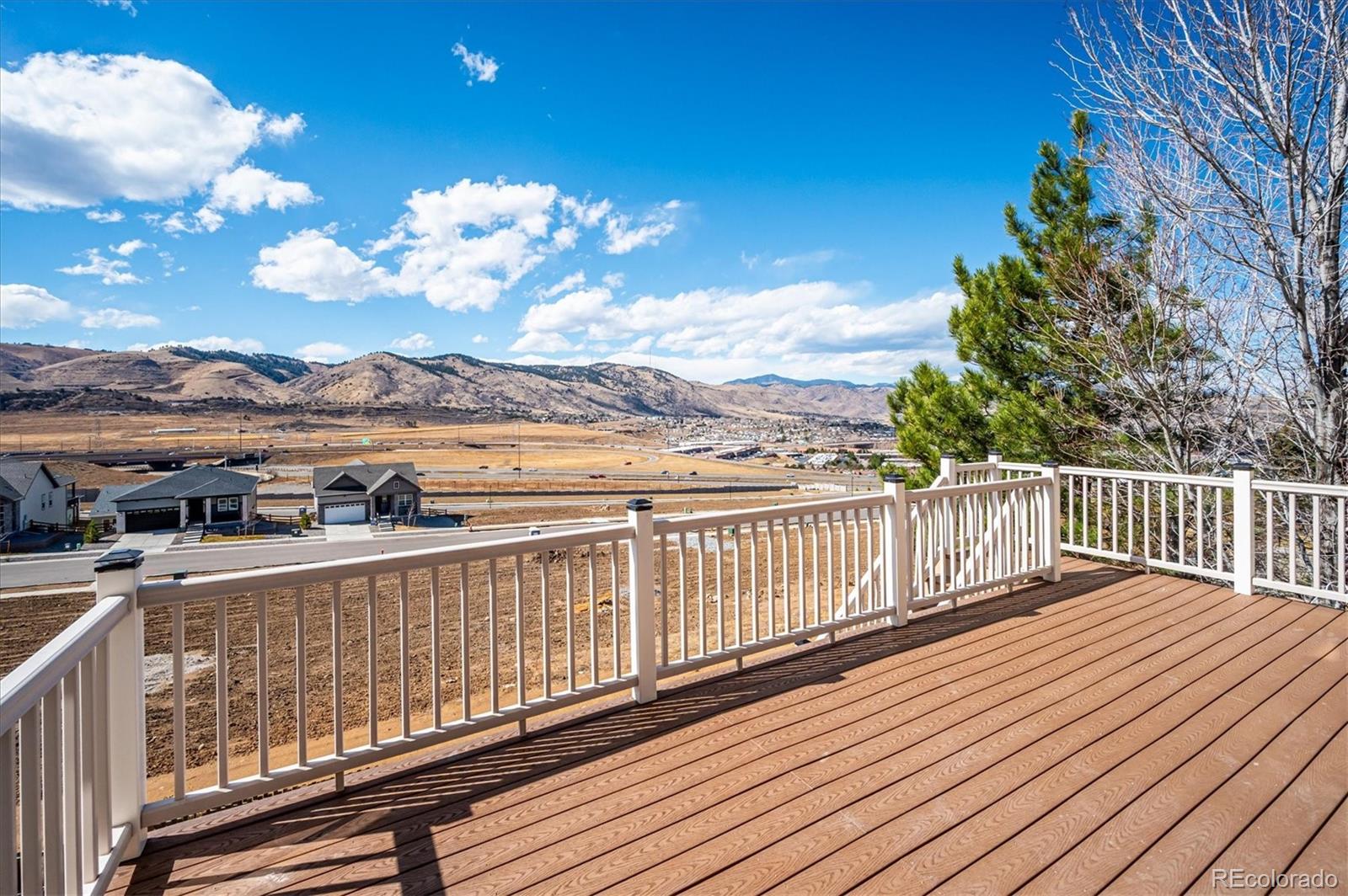 167 South Rogers Way Golden, CO 80401 - Photo 44 of 50 a view of a balcony with wooden floor