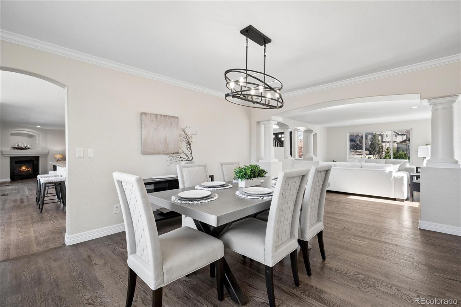 167 South Rogers Way Golden, CO 80401 - Photo 8 of 50 a view of a dining room with furniture wooden floor and chandelier