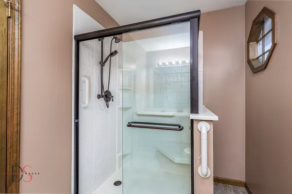 a bathroom with a glass shower door