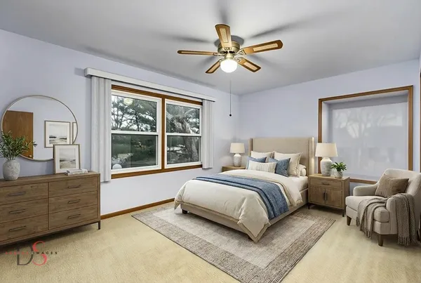 a spacious bedroom with a large bed and a chandelier