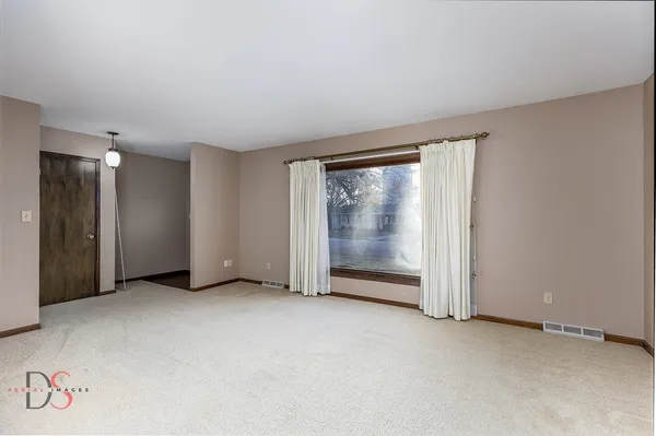 an empty room with sliding door