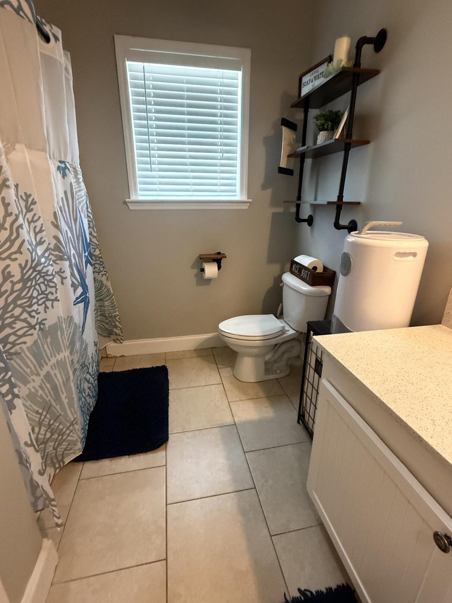 314 Ave D Key West, FL 33040 - Photo 12 of 23 a bathroom with a toilet and a bathtub