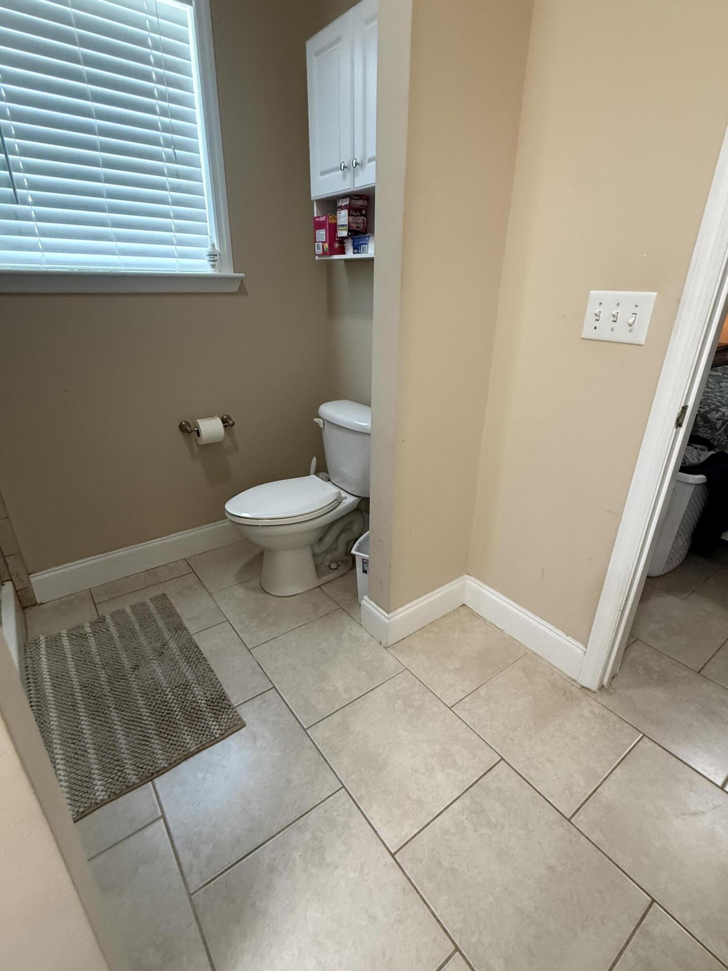 314 Ave D Key West, FL 33040 - Photo 15 of 23 a bathroom with a toilet