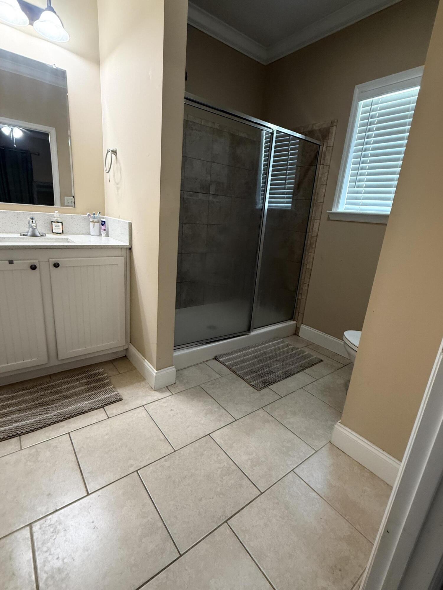 314 Ave D Key West, FL 33040 - Photo 16 of 23 a bathroom with a sink and a mirror