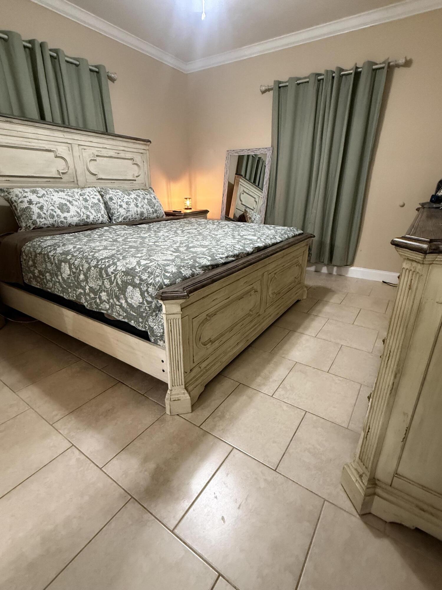 314 Ave D Key West, FL 33040 - Photo 17 of 23 a bedroom with a bed and a walk in closet