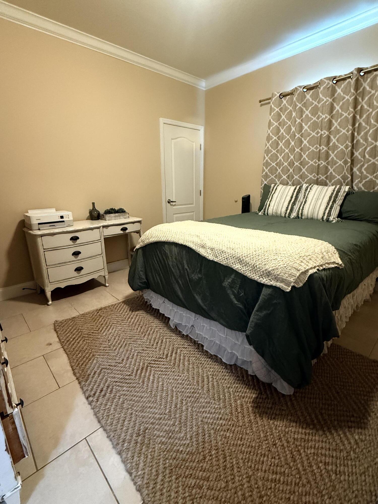 314 Ave D Key West, FL 33040 - Photo 18 of 23 a bedroom with a bed and a night stand