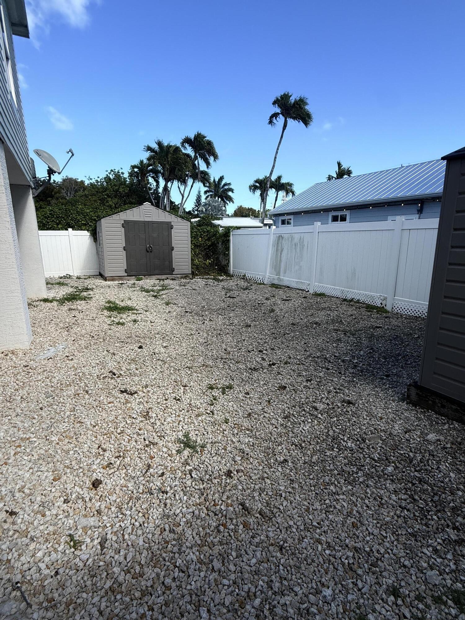 314 Ave D Key West, FL 33040 - Photo 3 of 23 a view of a terrace with a bench