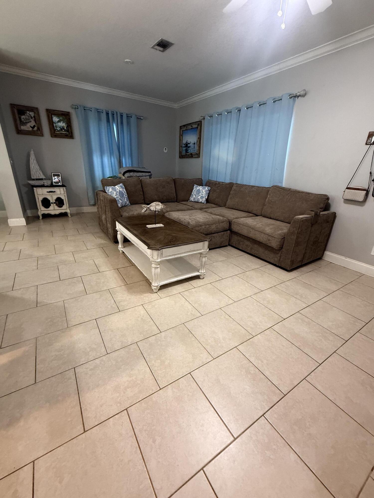 314 Ave D Key West, FL 33040 - Photo 9 of 23 a living room with furniture and a flat screen tv