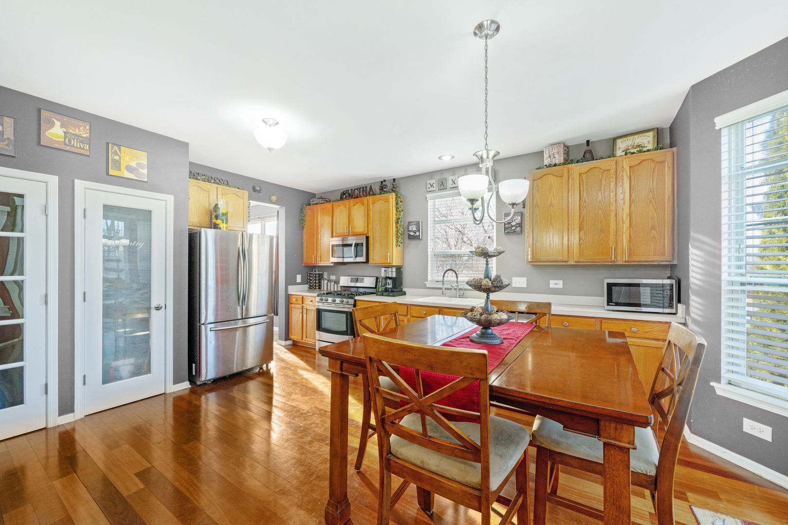 232 Burton Drive Bartlett, IL 60103 - Photo 5 of 20 a view of a dining room with furniture window and wooden floor