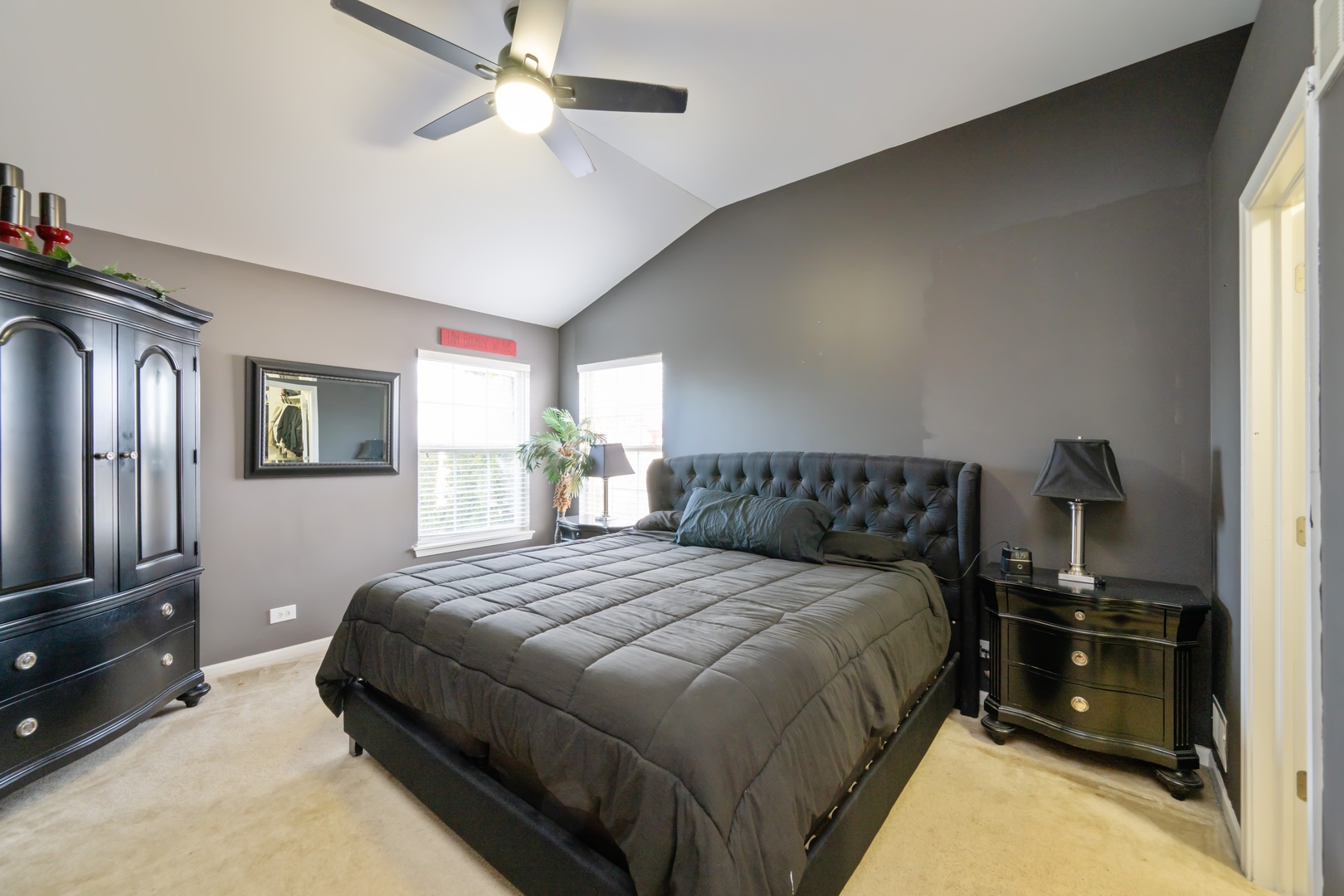 232 Burton Drive Bartlett, IL 60103 - Photo 9 of 20 a bedroom with a bed and a tv