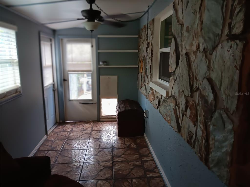 374 3rd Street Northwest Largo, FL 33770 - Photo 17 of 31 a hallway with windows and stairs
