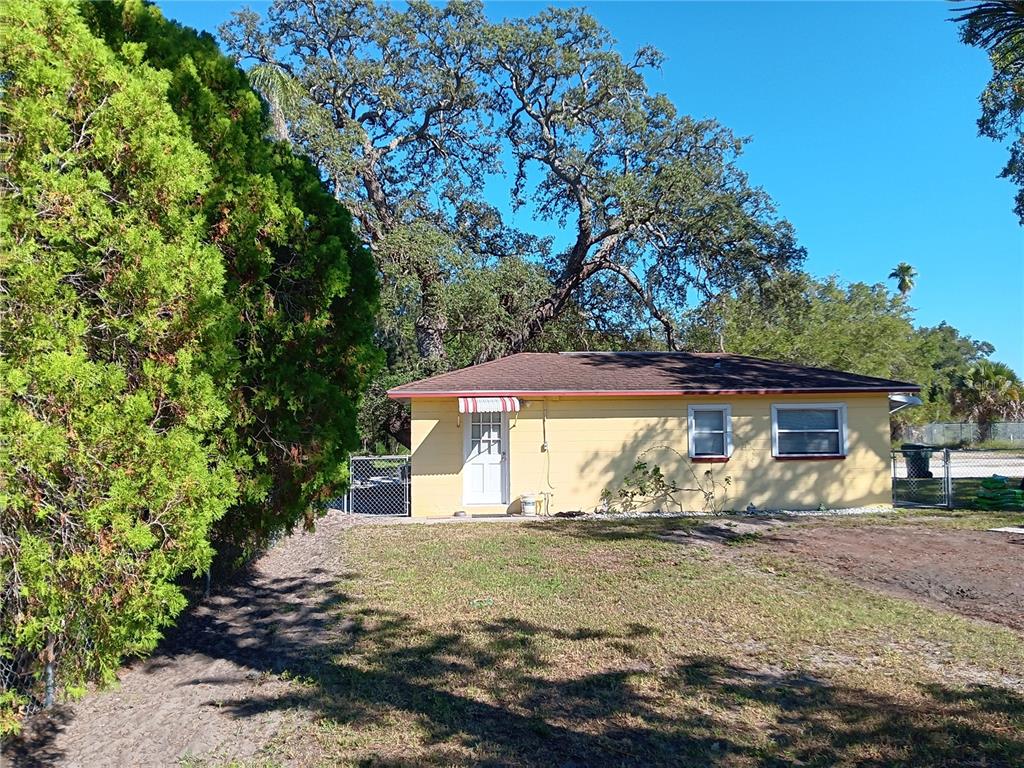 374 3rd Street Northwest Largo, FL 33770 - Photo 19 of 31 a view of a house with a yard