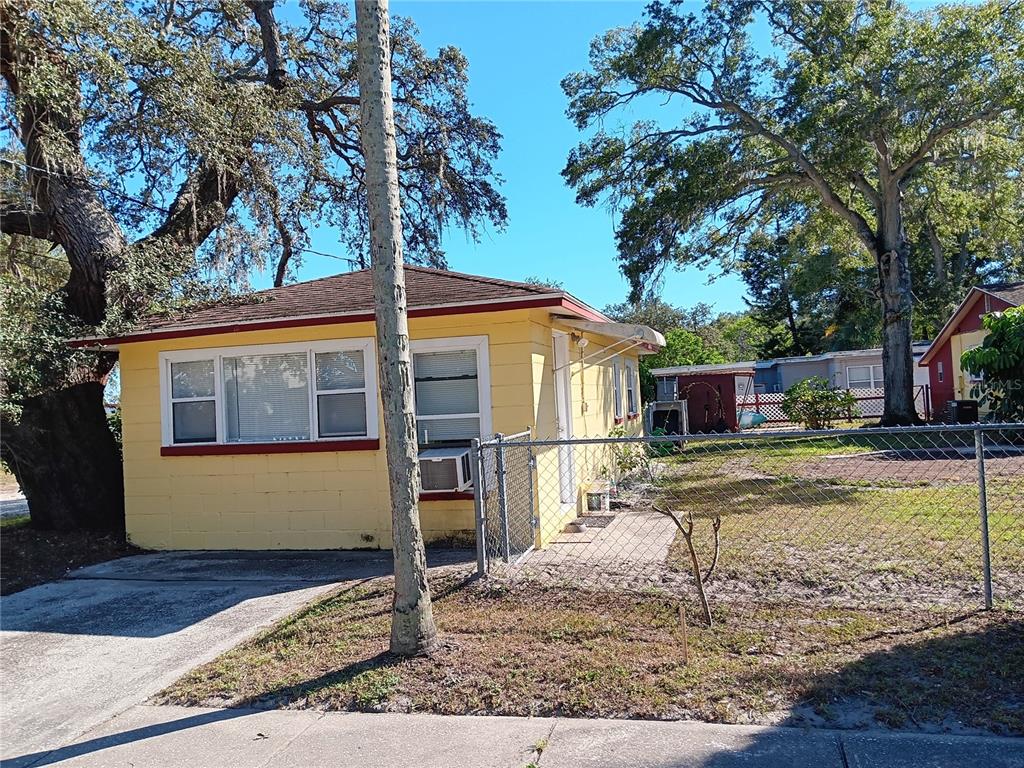 374 3rd Street Northwest Largo, FL 33770 - Photo 20 of 31 a view of a house with a yard