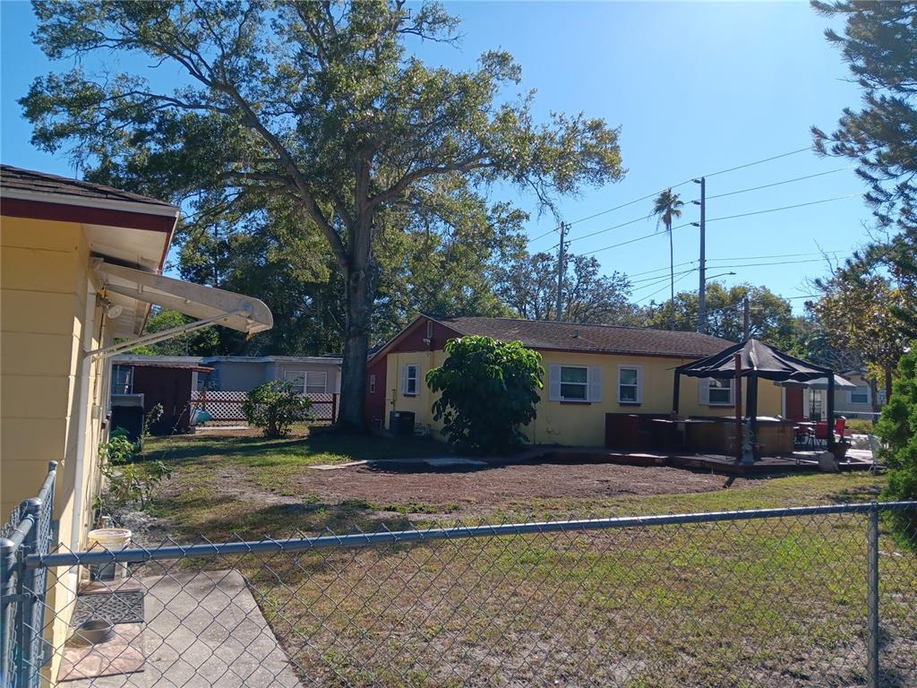 374 3rd Street Northwest Largo, FL 33770 - Photo 2 of 31 a front view of a house with a yard