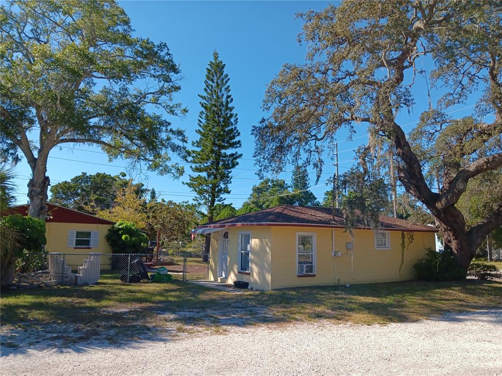 374 3rd Street Northwest Largo, FL 33770 - Photo 21 of 31 a view of a house with a yard