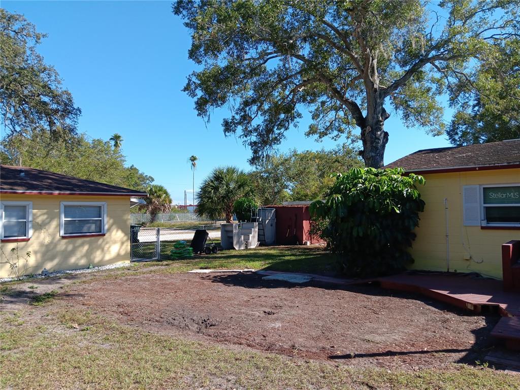 374 3rd Street Northwest Largo, FL 33770 - Photo 23 of 31 a view of a house with backyard and a tree