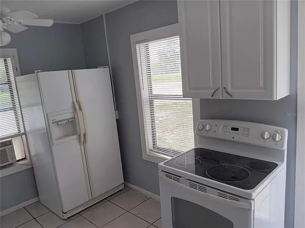 a bathroom with a sink toilet and window