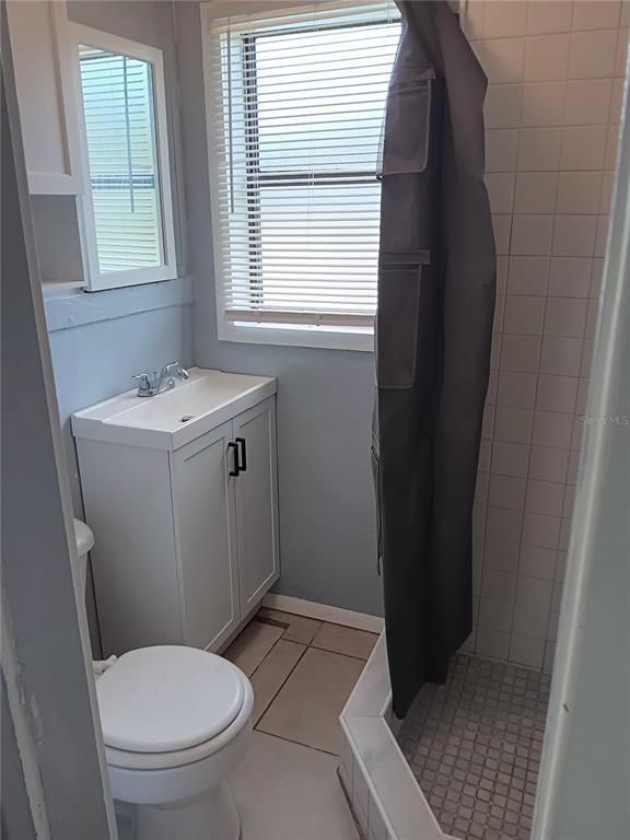 374 3rd Street Northwest Largo, FL 33770 - Photo 29 of 31 a bathroom with a sink toilet and window