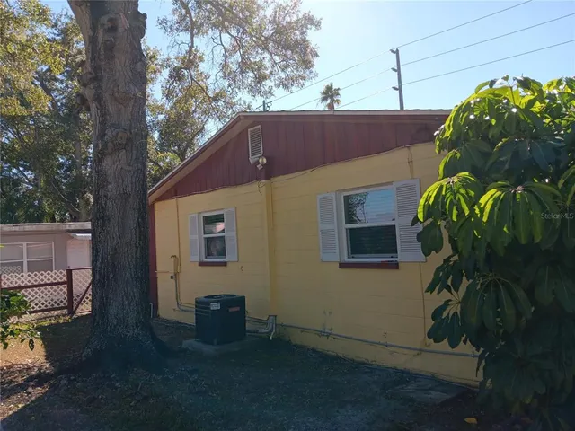 a living room with furniture and a lamp
