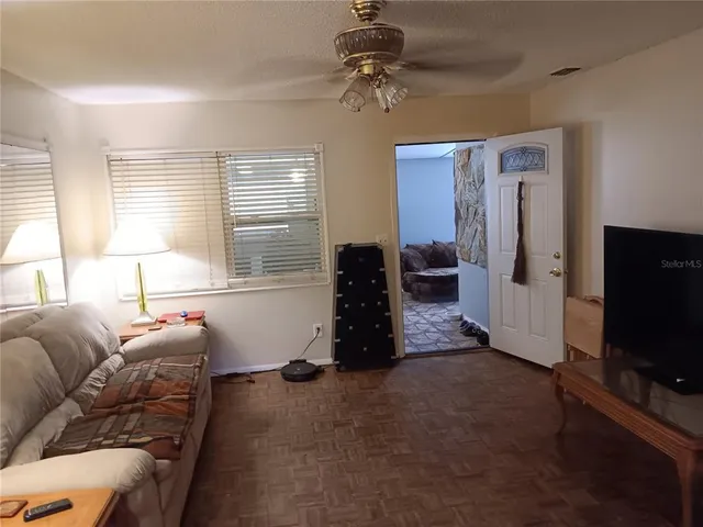 a bathroom with a sink a toilet and shower curtain