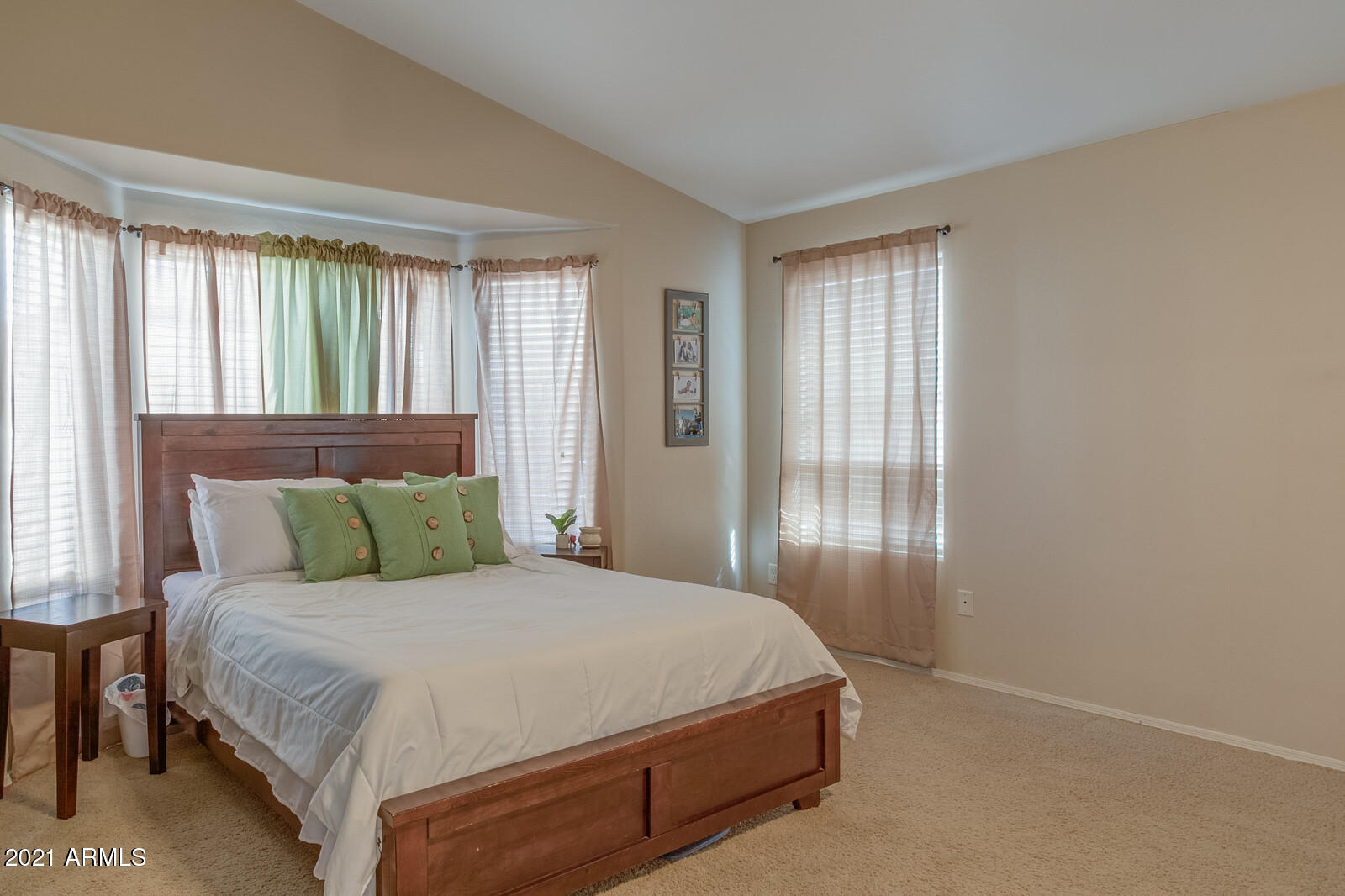 1114 East Fraktur Road Phoenix, AZ 85040 - Photo 11 of 23 a bed sitting in a bedroom next to a window
