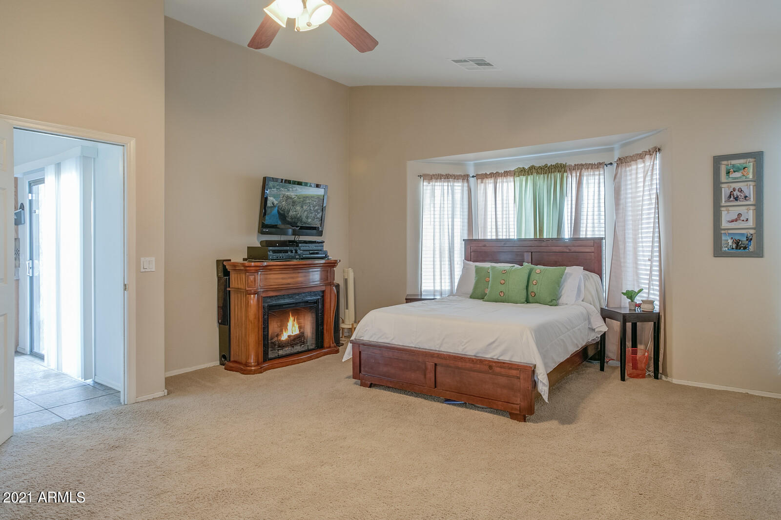 1114 East Fraktur Road Phoenix, AZ 85040 - Photo 12 of 23 a bedroom with a bed and a fireplace