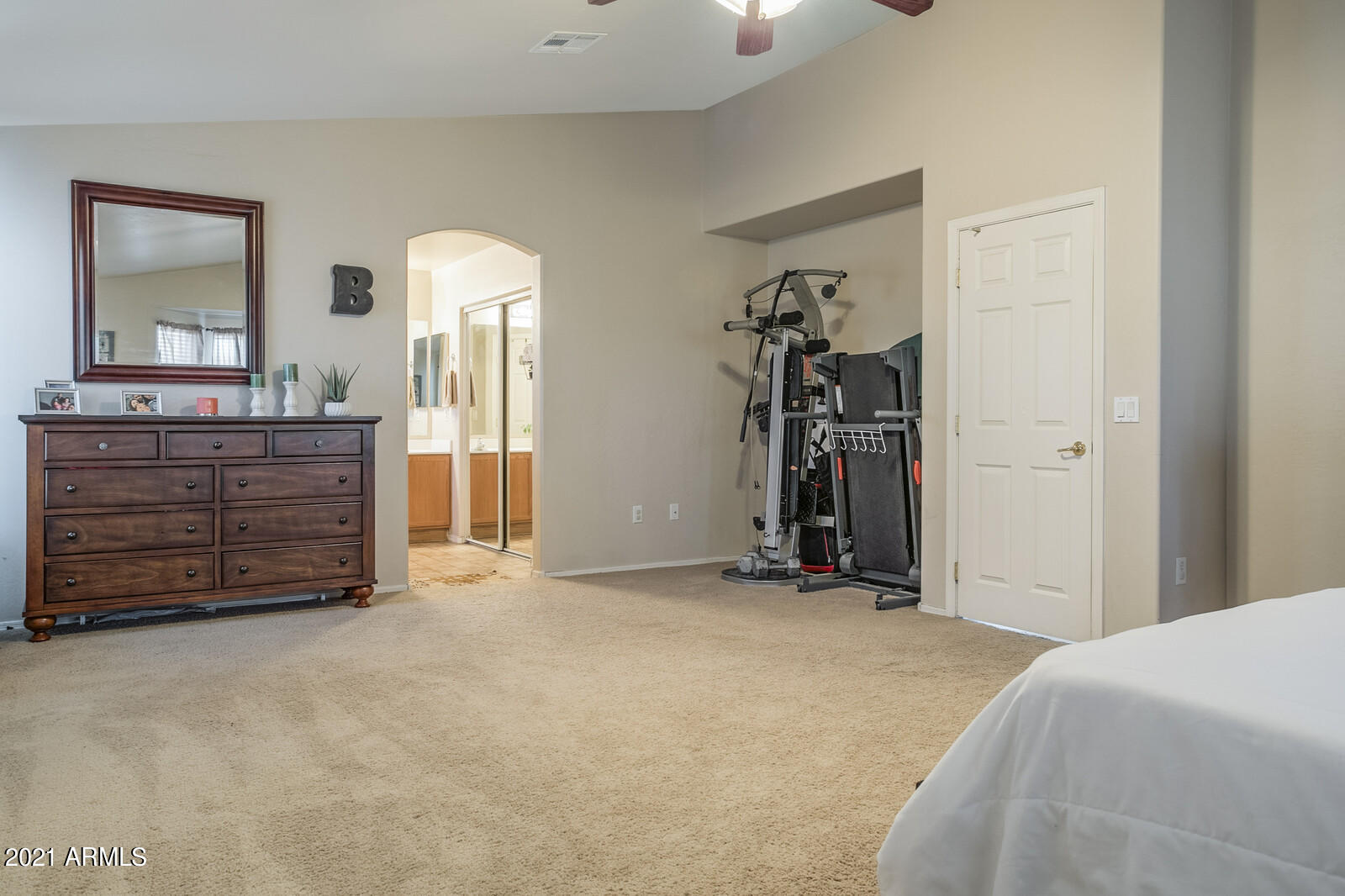 1114 East Fraktur Road Phoenix, AZ 85040 - Photo 13 of 23 a view of a bedroom with cabinet mirror and furniture