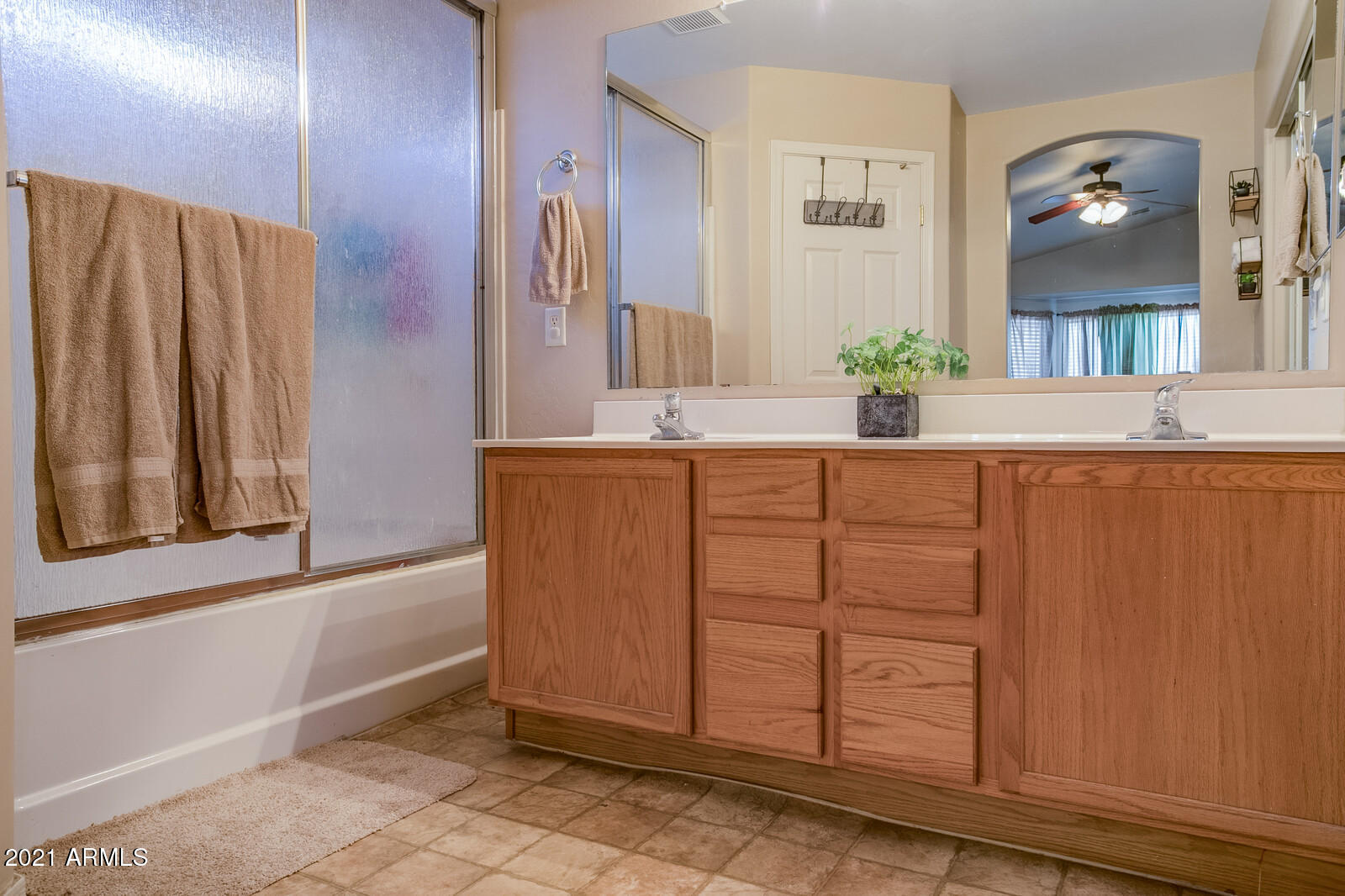 1114 East Fraktur Road Phoenix, AZ 85040 - Photo 14 of 23 a bathroom with a granite countertop sink and a mirror