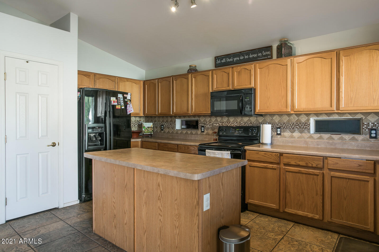 1114 East Fraktur Road Phoenix, AZ 85040 - Photo 8 of 23 a kitchen with stainless steel appliances granite countertop a stove sink and cabinets