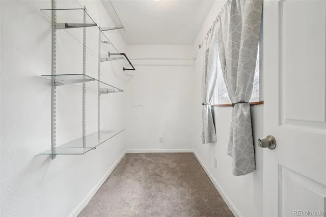 a bathroom with a sink a mirror and a shower