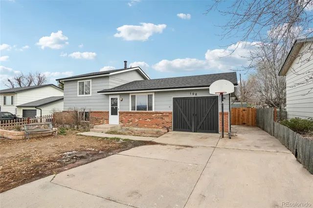a front view of a house with yard