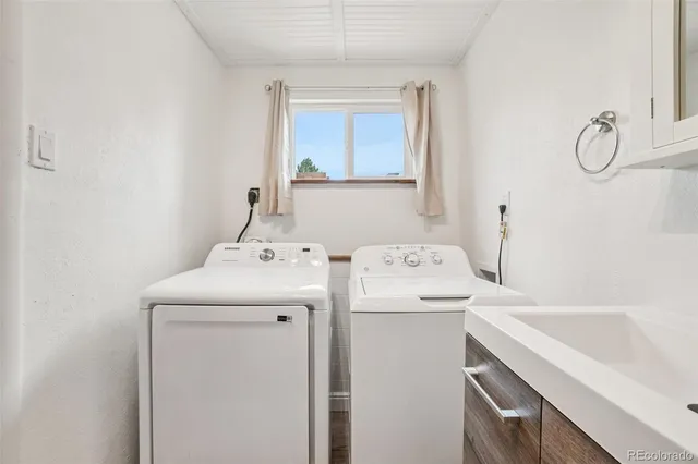 a view of a patio with a chairs and table in the patio