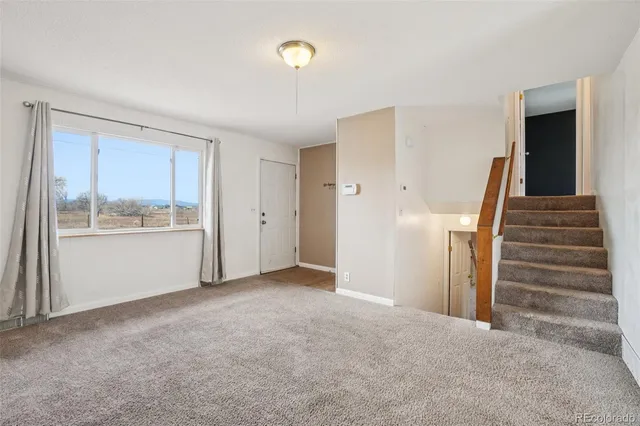 a kitchen with stainless steel appliances a refrigerator and a stove