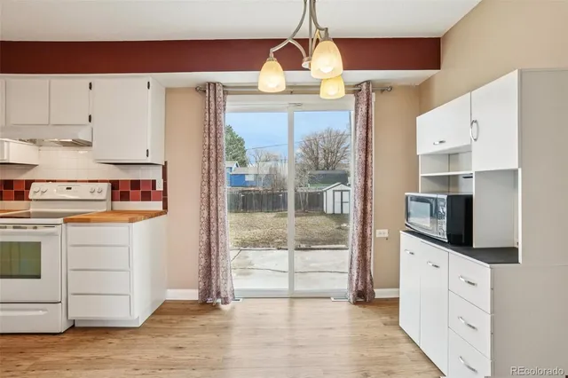 a view of a kitchen from the hallway