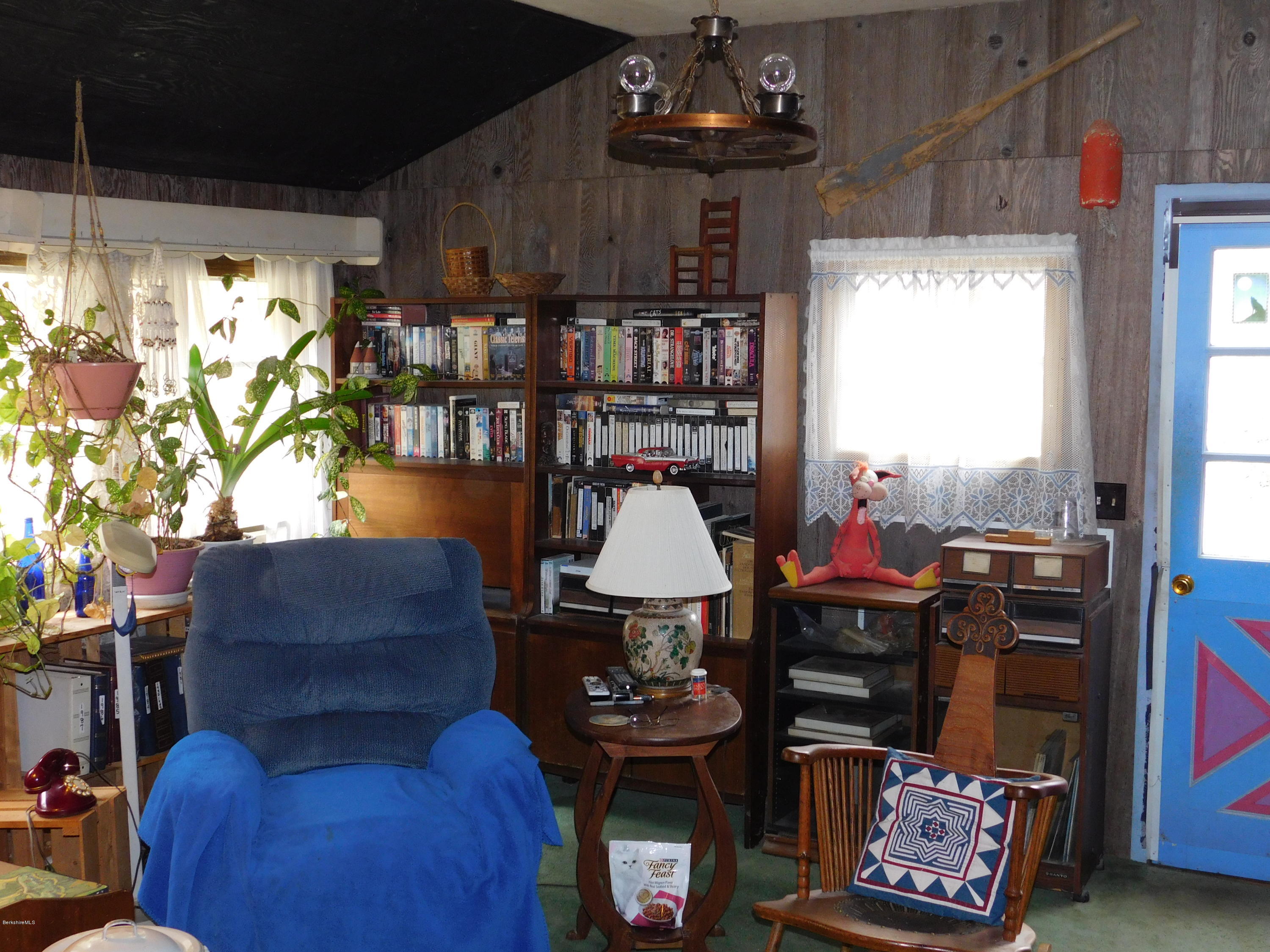 94 River Road Savoy, MA 01256 - Photo 12 of 36 a living room with furniture and a chandelier