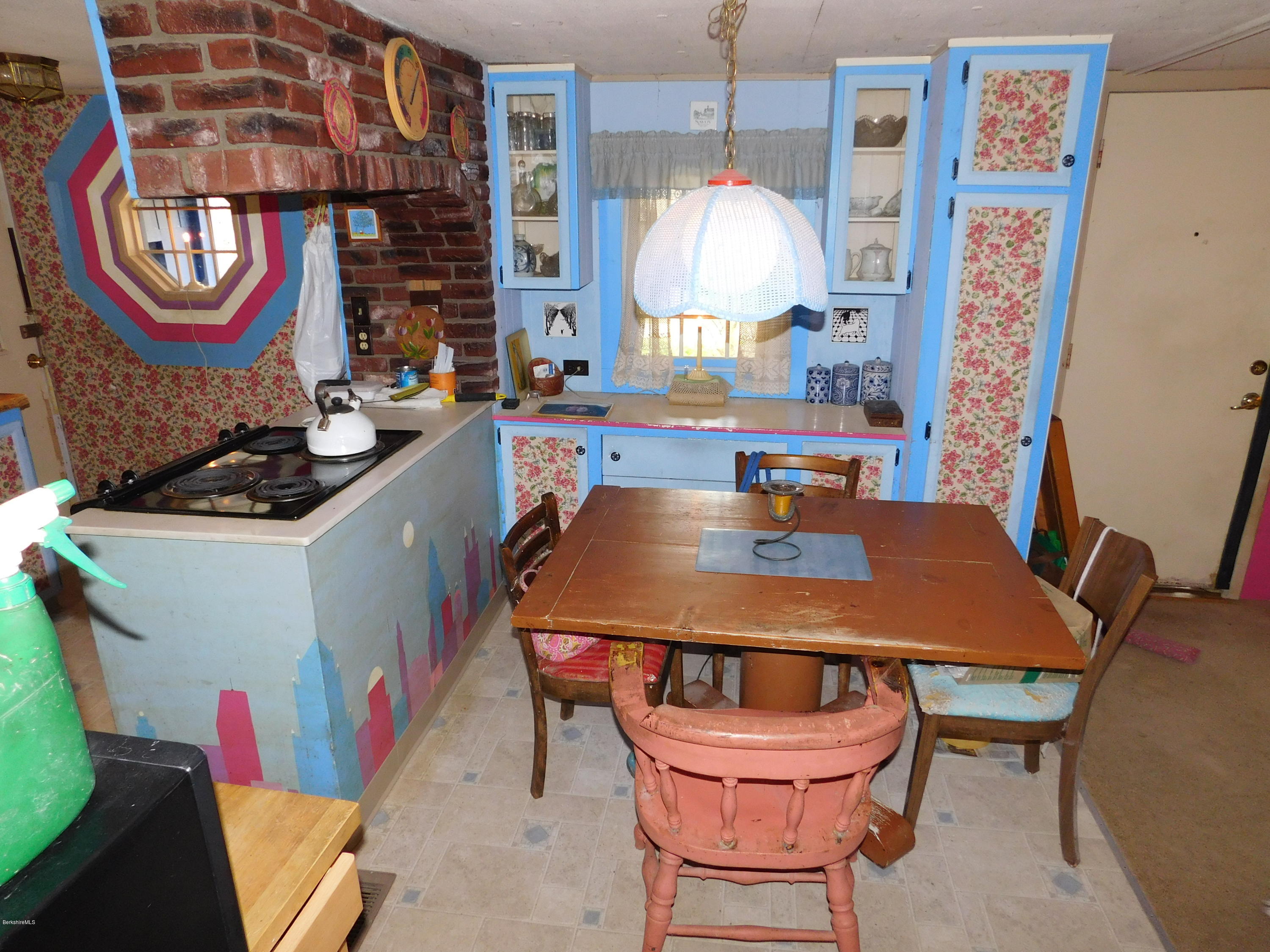 94 River Road Savoy, MA 01256 - Photo 15 of 36 a view of a dining room with furniture and chandelier