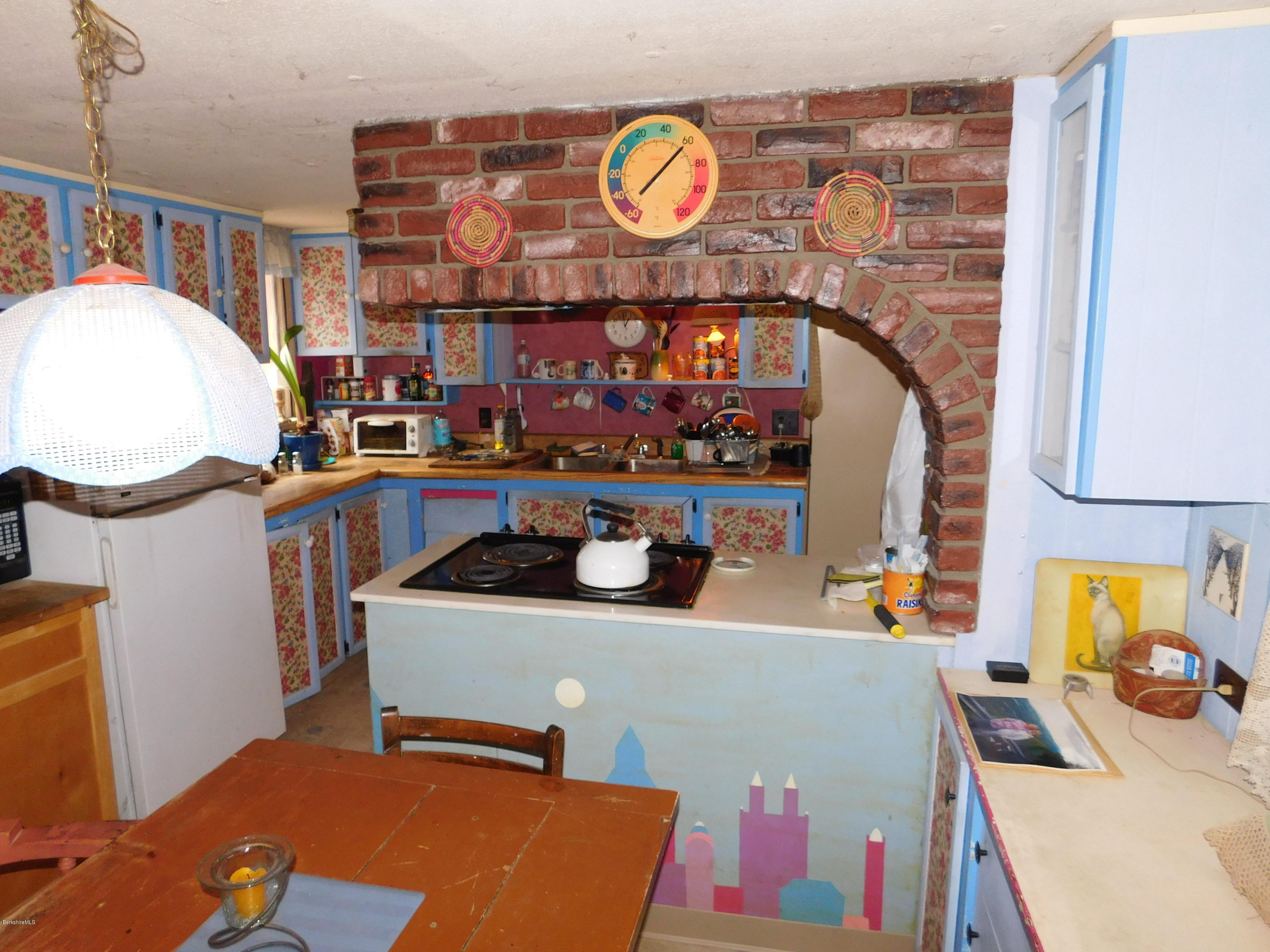 94 River Road Savoy, MA 01256 - Photo 17 of 36 a room with table and chairs