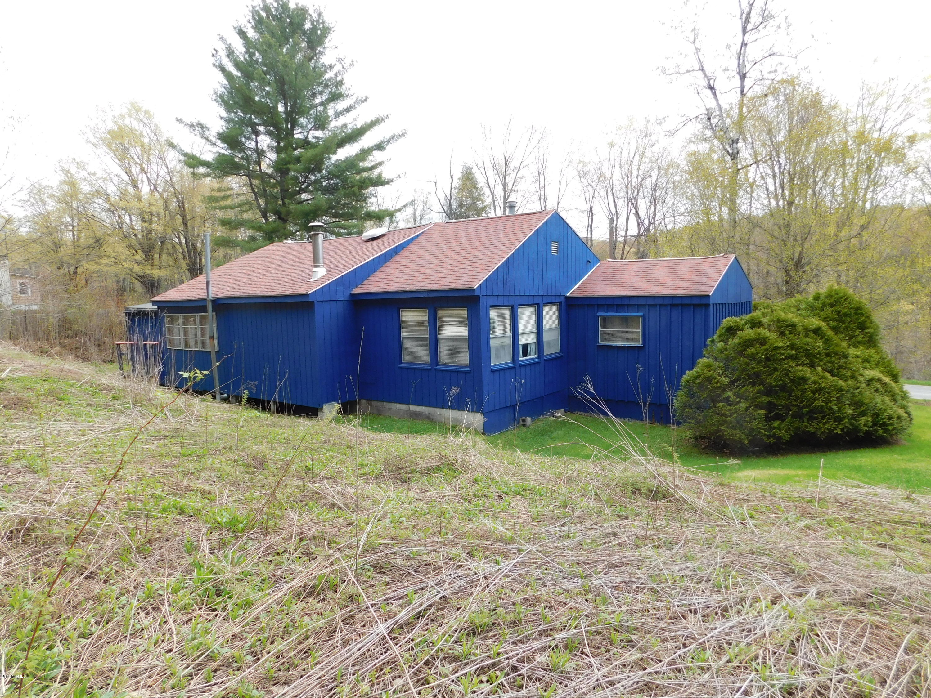 94 River Road Savoy, MA 01256 - Photo 3 of 36 a view of a yard with a house and a large tree