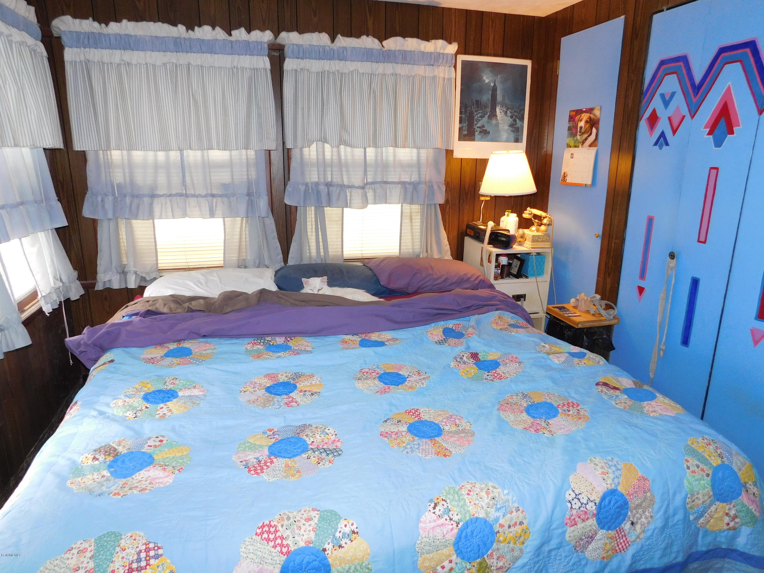 94 River Road Savoy, MA 01256 - Photo 22 of 36 a bedroom with a bed and a window