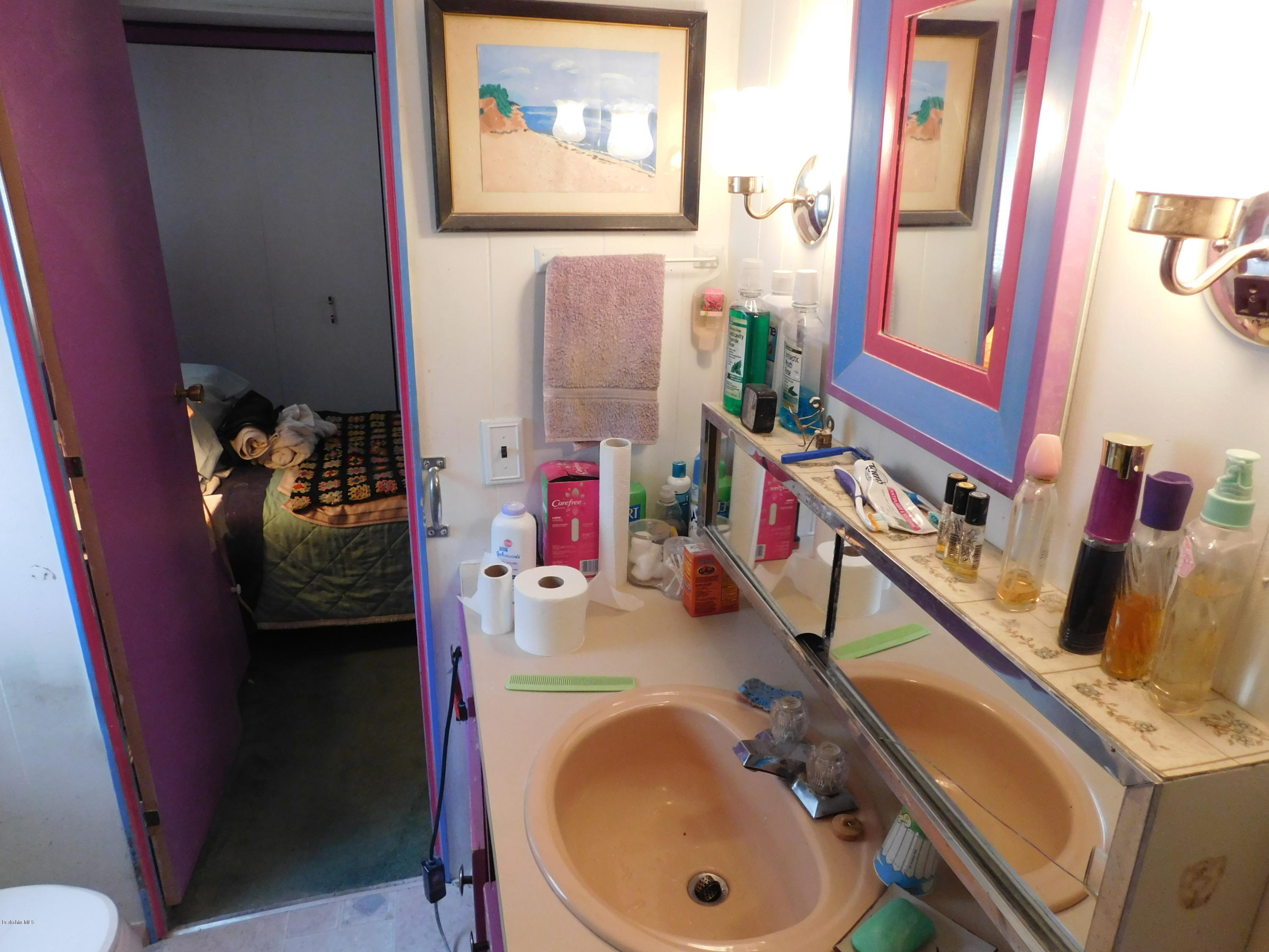 94 River Road Savoy, MA 01256 - Photo 27 of 36 a bathroom with a sink and a mirror