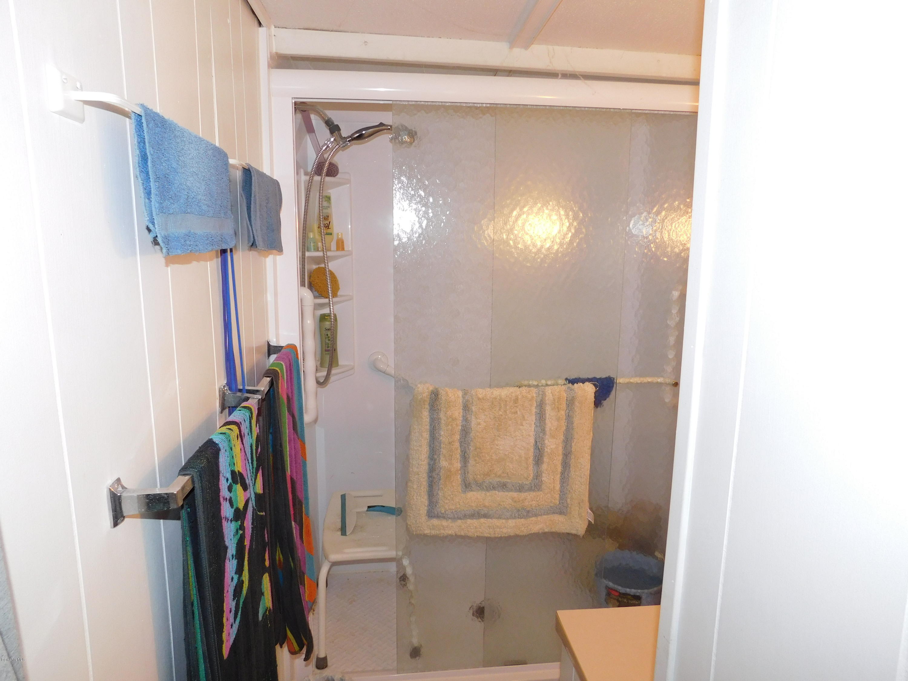 94 River Road Savoy, MA 01256 - Photo 28 of 36 a view of walk in closet with clothes and shoes