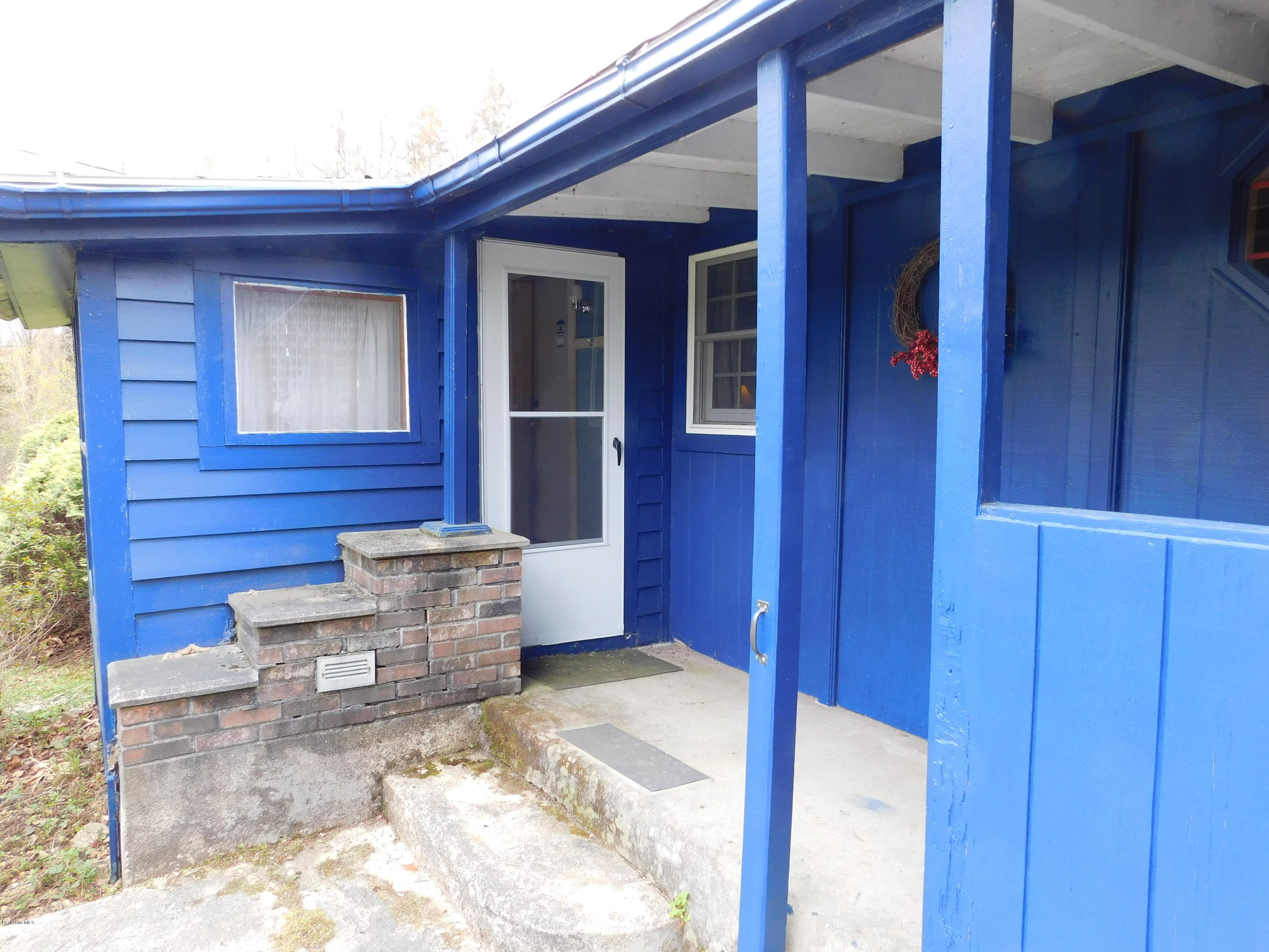 94 River Road Savoy, MA 01256 - Photo 6 of 36 a view of front door of house