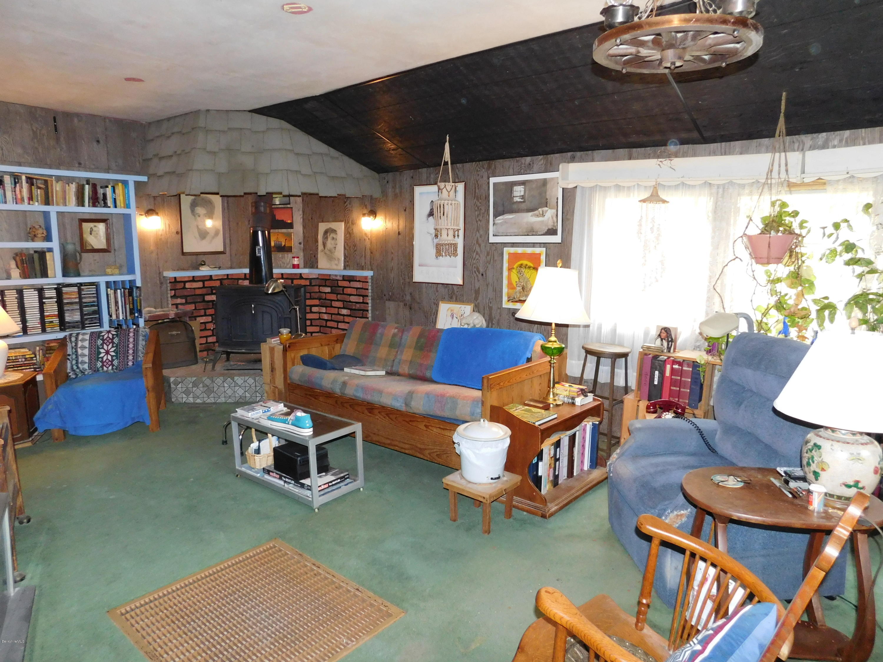 94 River Road Savoy, MA 01256 - Photo 8 of 36 a living room with furniture and a table