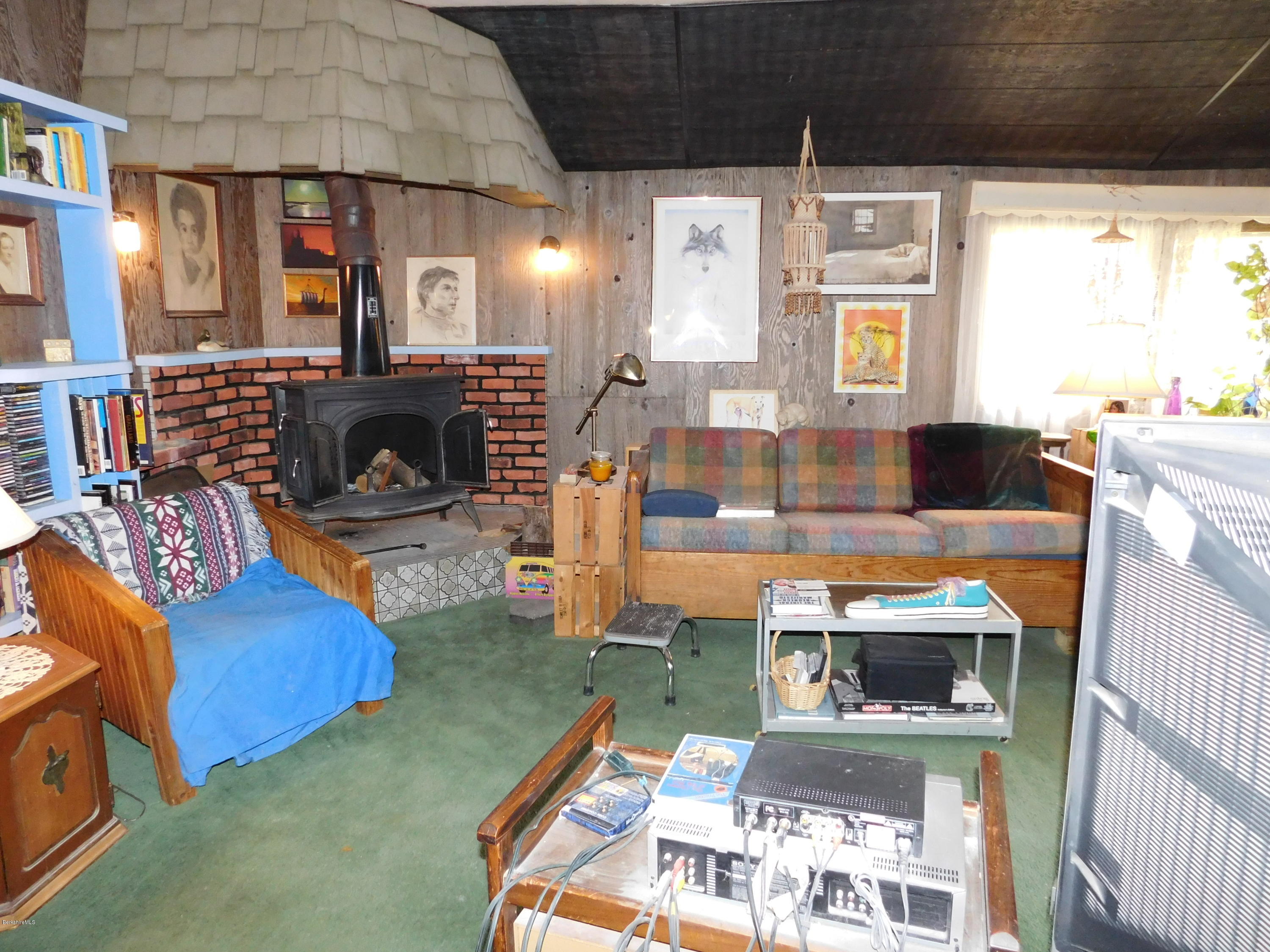 94 River Road Savoy, MA 01256 - Photo 9 of 36 a living room with furniture and a fireplace