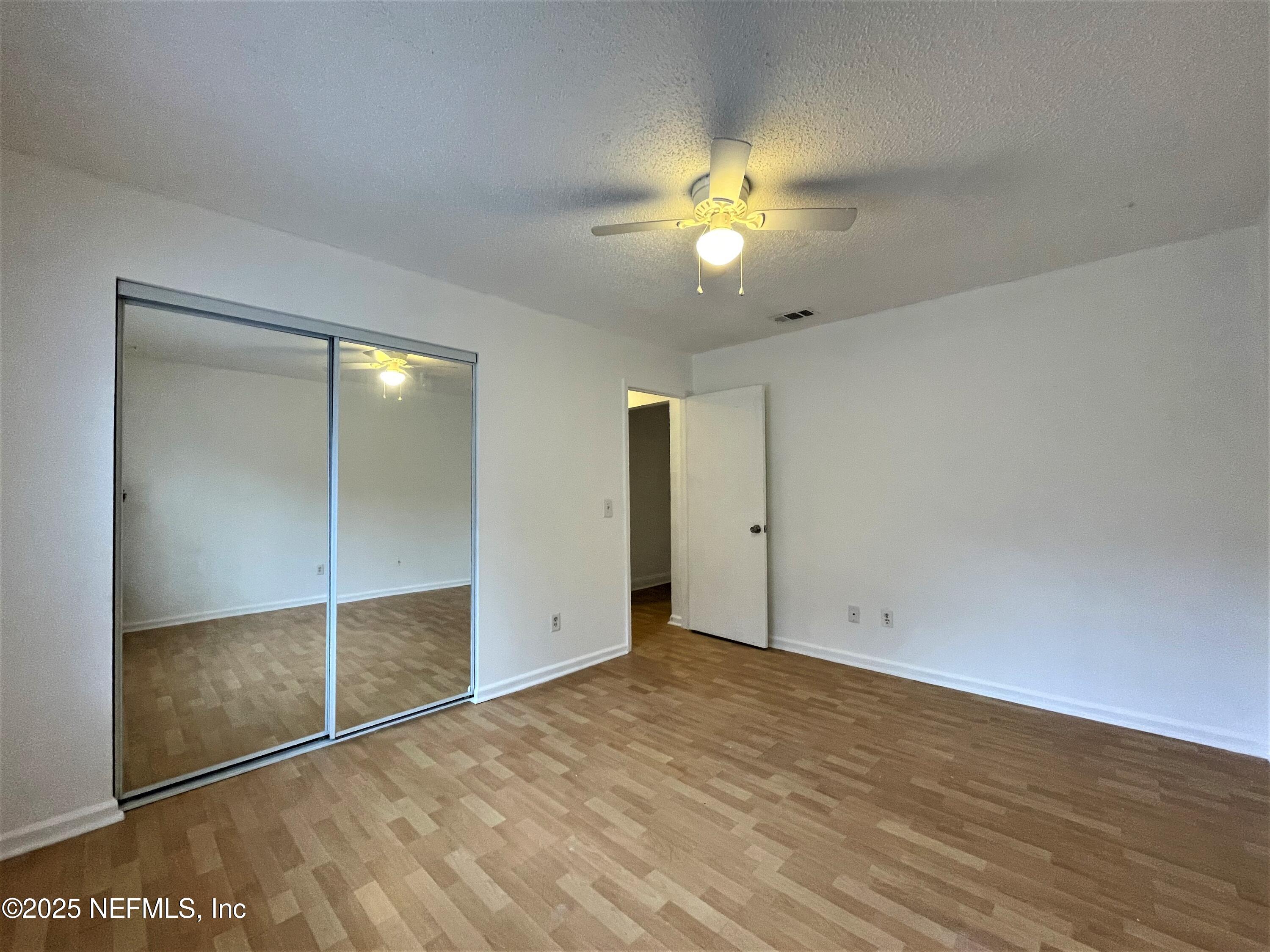 2910 Post Street Jacksonville, FL 32205 - Photo 9 of 12 an empty room with fan and entrance