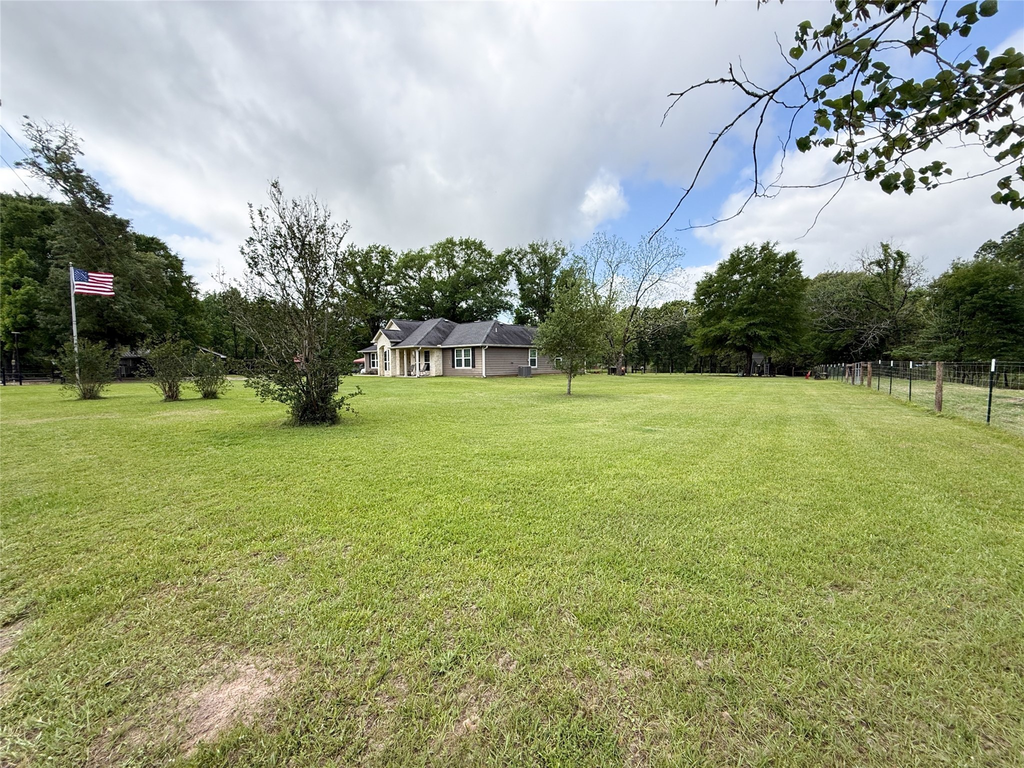 12220 Fm 356 Trinity, TX 75862 - Photo 8 of 50 a view of a field with a tree in the background