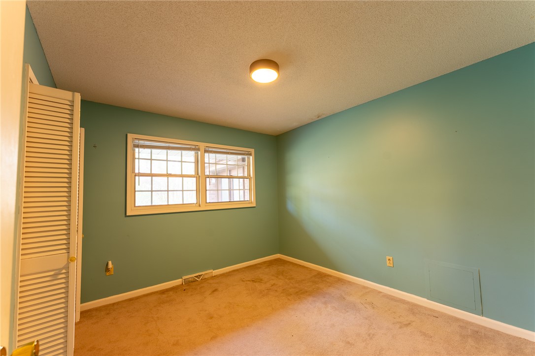 139 Todds Creek Road Central, SC 29630 - Photo 24 of 45 This spacious bedroom offers ample natural light and a classic design.