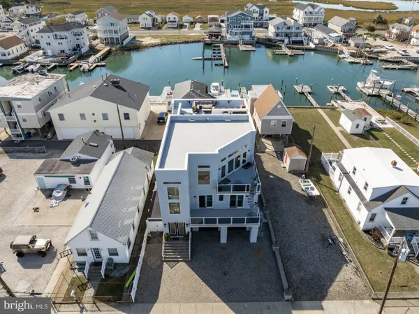 an aerial view of a house with wooden floor and city view