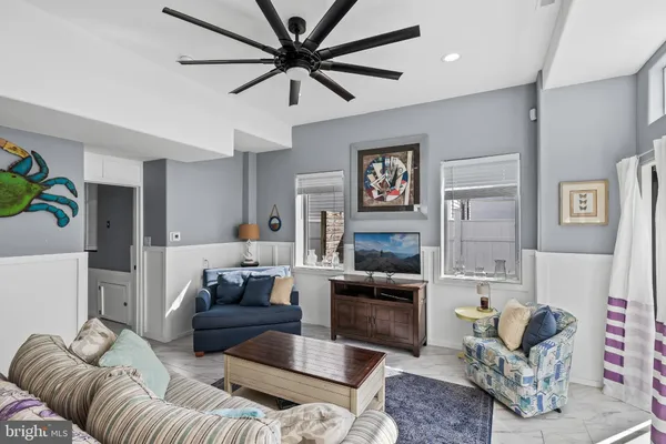 a kitchen with stainless steel appliances a stove a refrigerator a sink a stove with wooden floor and cabinets