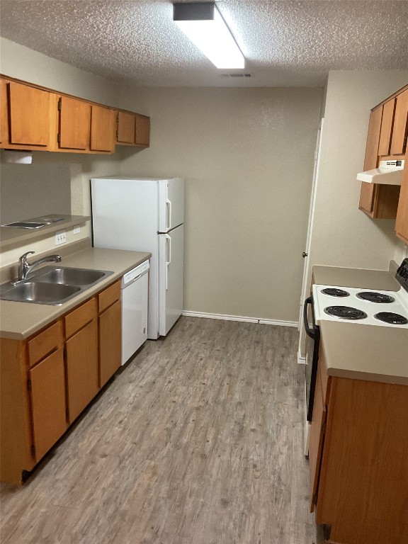 383 Fantail Loop Austin, TX 78734 - Photo 3 of 7 a kitchen with a stove and a sink